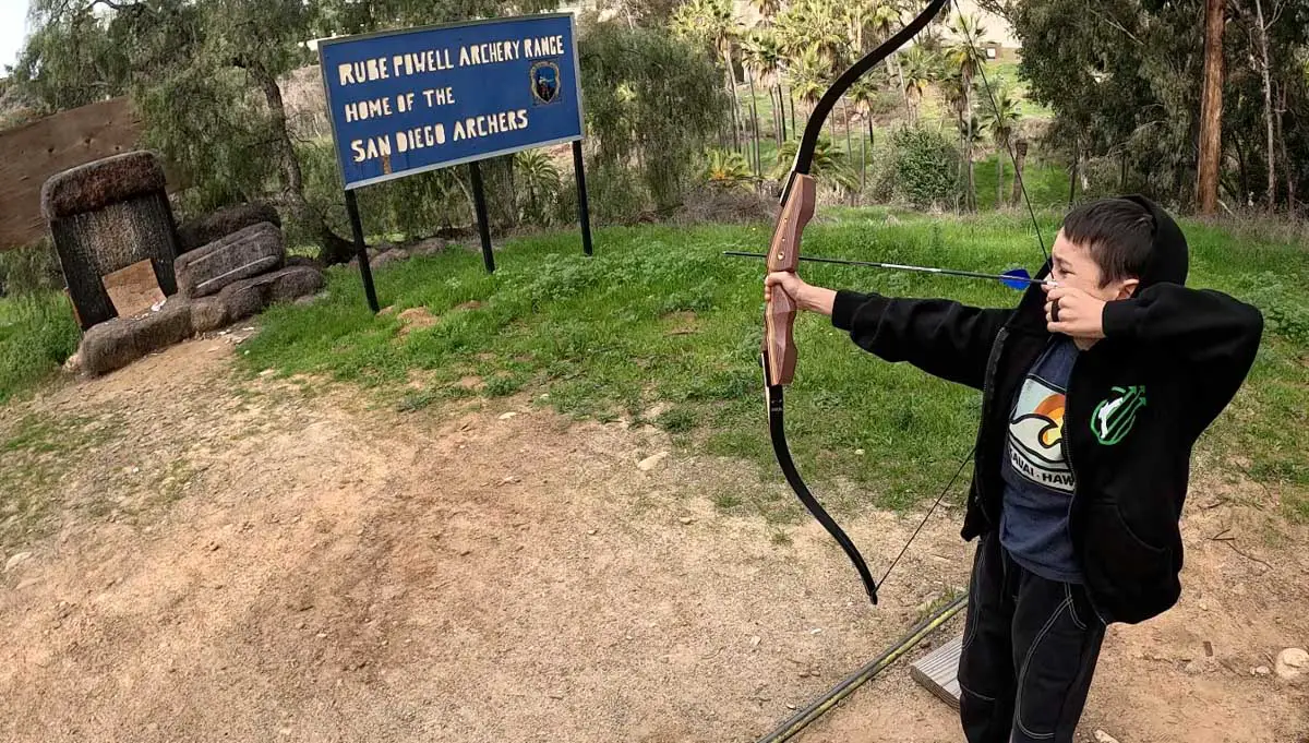 Child shooting bow at San Diego Archery Range